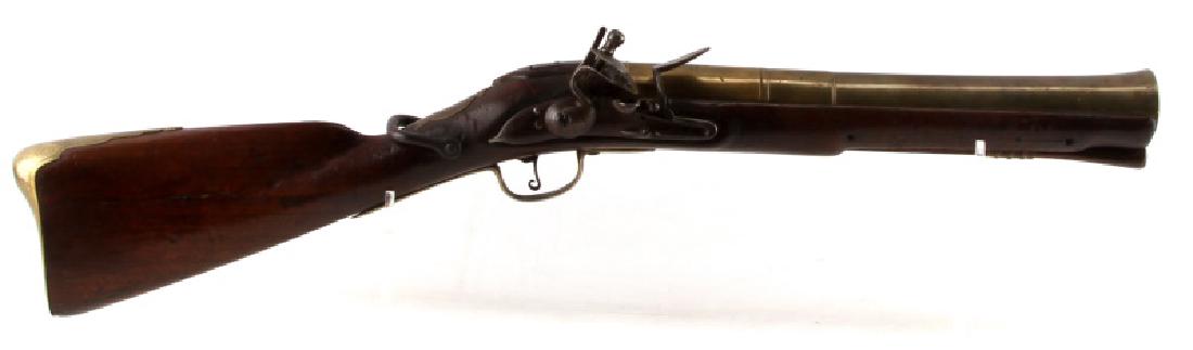 1740 ENGLISH FLINTLOCK BLUNDERBUSS LONDON BRASS: Full wood stock, brass flared 14.75 inch barrel, "London" and proof marks to top and left side. Iron furniture, engraved design to barrel, breech, and butt plate. Ramrod present. Entire length is 30.5