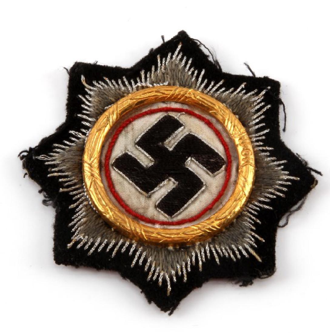 WWII THIRD REICH CLOTH GERMAN PANZER CROSS CLOTH: Cloth patch version of the German Cross for the panzer corps, with a gold ring. In very good condition, with some thinning of the cloth on the back. Measures 3 3/4 inches in diameter.