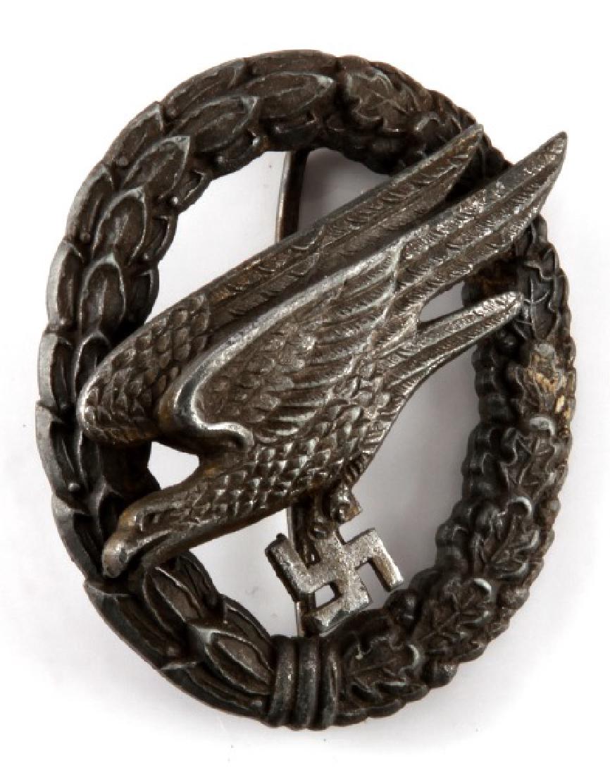 WWII GERMAN 3RD REICH LUFTWAFFE PARATROOPER BADGE: WWII Third Reich Germany Luftwaffe Paratrooper badge. Early pattern with prominent details. 2 rivet construction with vertical pin and barrel hinge. Maker's marks. Some tarnish. Very good condition.