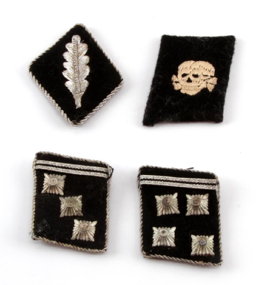 4 GERMAN WWII WAFFEN SS COLLAR TABS: Includes Standartenführer Version 2, 3 SS Panzer Division - Totenkopf Vertical pattern, Obersturmführer Type 2, and Obersturmbannführer. All pass black light test and are in VG condition.