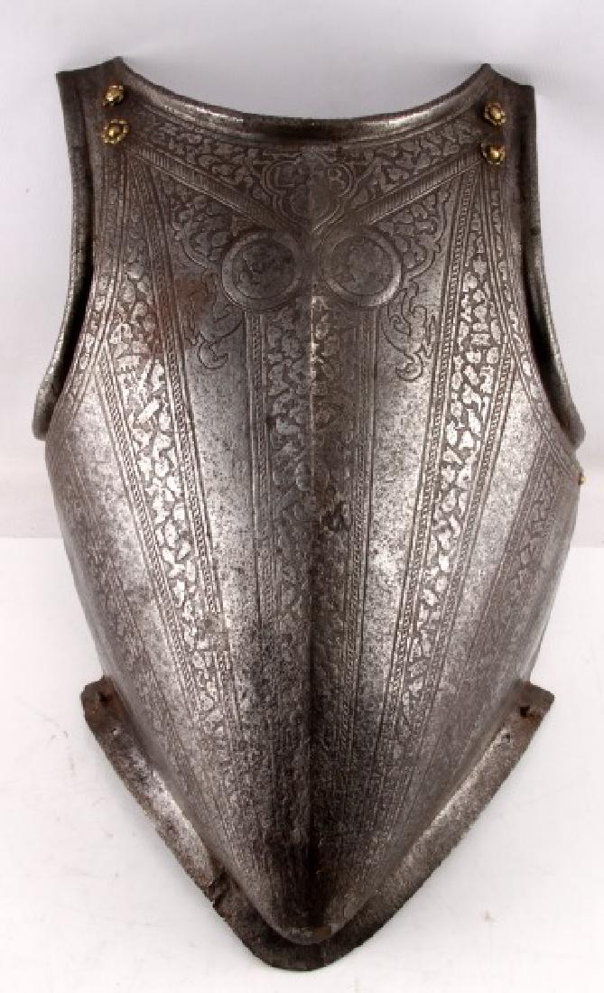 16TH CENTURY CONQUISTADOR SPANISH BREASTPLATE: Breastplate in a 16th century Spanish style, part of a larger full set. Very decorated with engravings, with bright brass fittings. In very good condition, with some rust, a few small rents in the met
