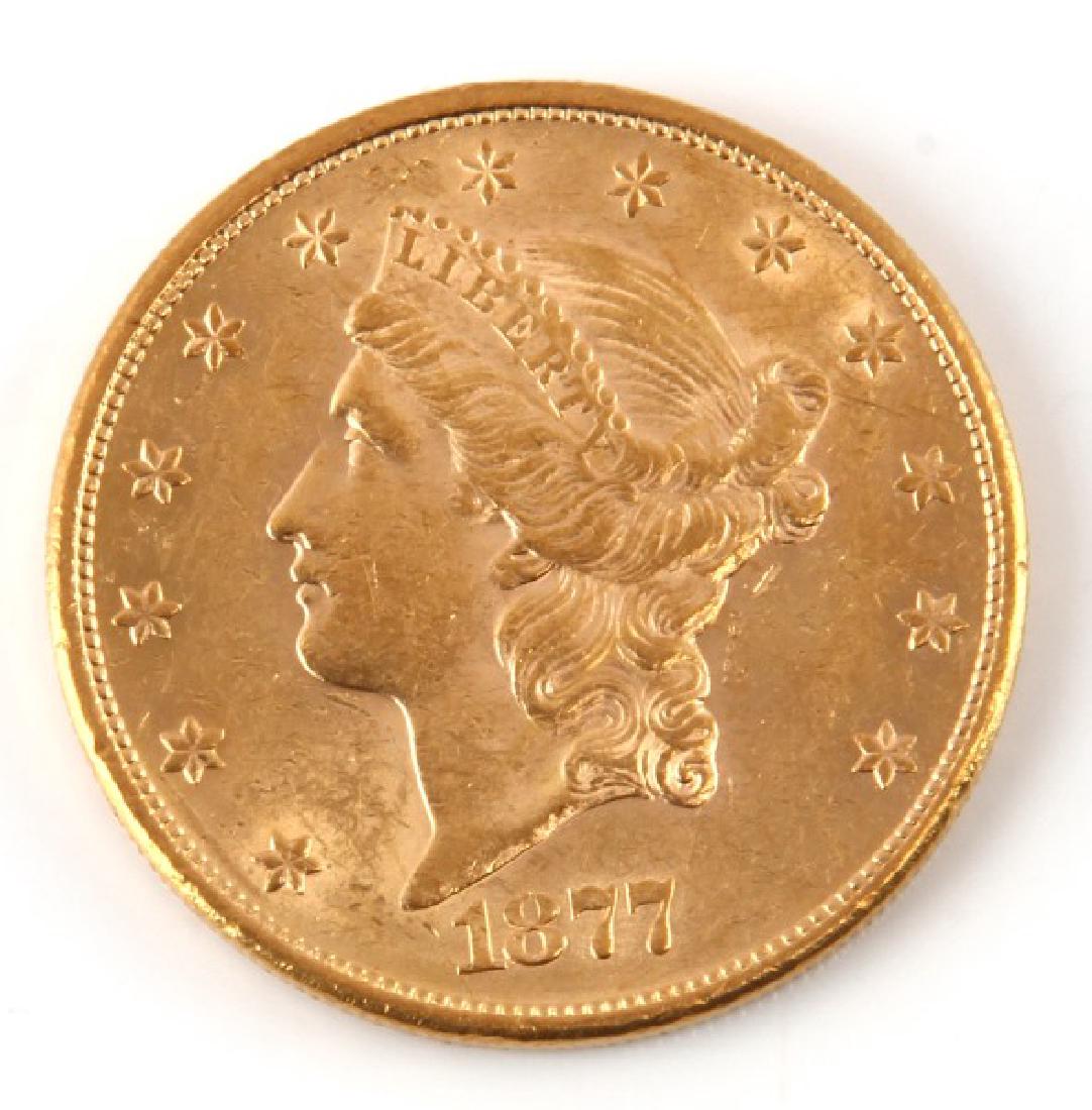 1877 $20 LIBERTY DOUBLE EAGLE GOLD COIN AU: AU-50, There is trace wear on the hair, over and coronet. On reverse trace of wear is visible on wing tips neck and shield.