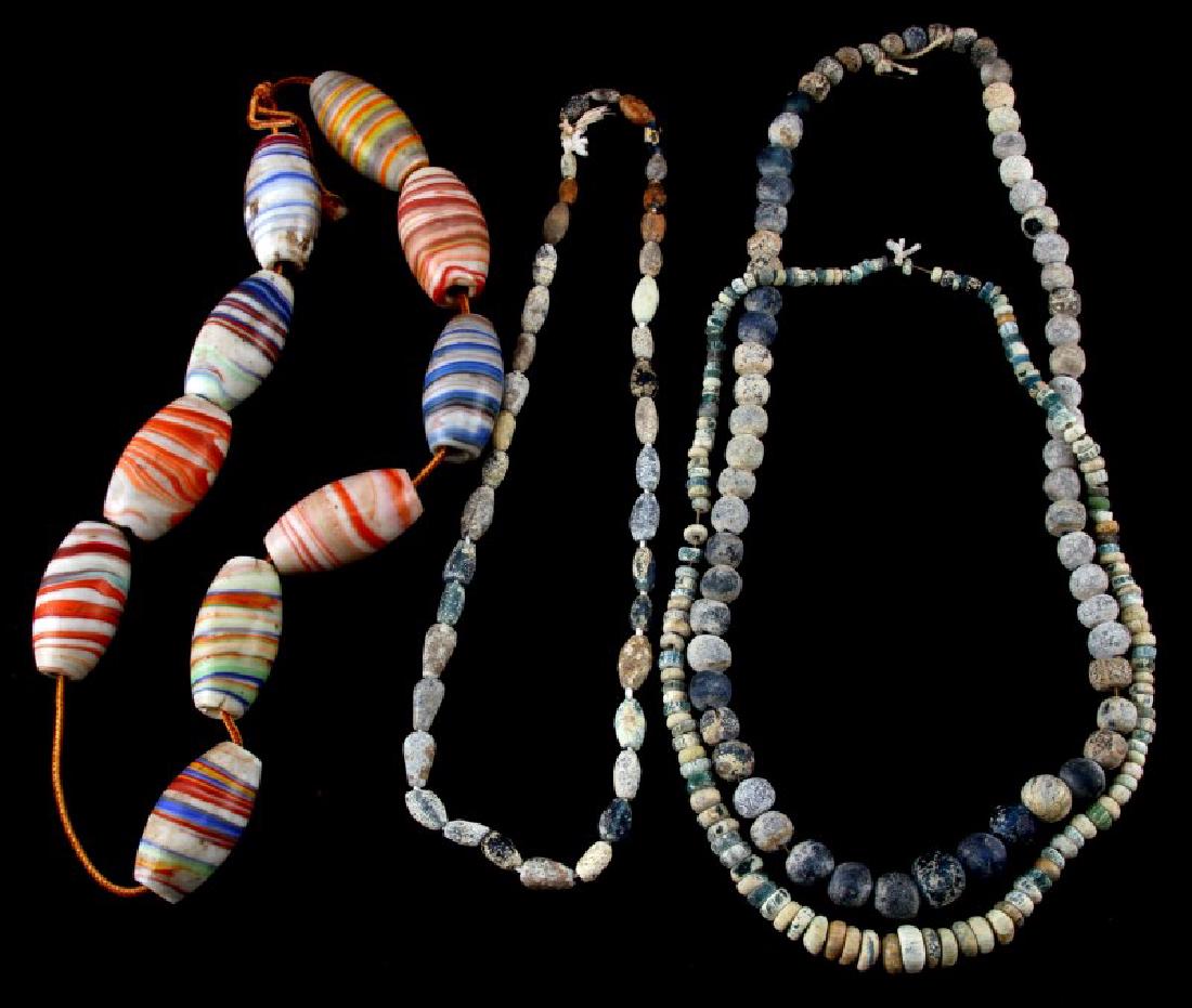 1600S FRENCH COLONIAL & VENETIAN TRADING BEADS: Three strands of French Colonial trading beads, includes translucent blues , from 1660- 1710 found in Creek and Choctaw Indian sites in Alabama by Peter Brennan 1932-1933. Along with 10 large Venetian