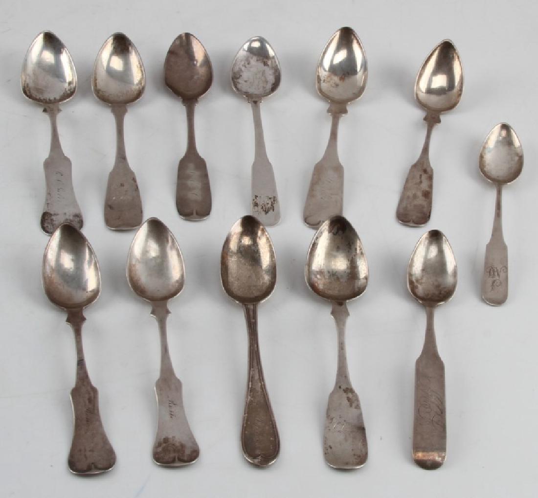12 ANTIQUE ASSORTED COIN SILVER FIDDLE SPOON LOT: Antique coin silver teaspoons (circa 1830s) includes: F.D. Barnum & Co., Clark, Pooley, Leslie, Merriman, Wells, and more. Coin & maker's marks. Engraved/monogrammed handles. Tarnish/patina present.