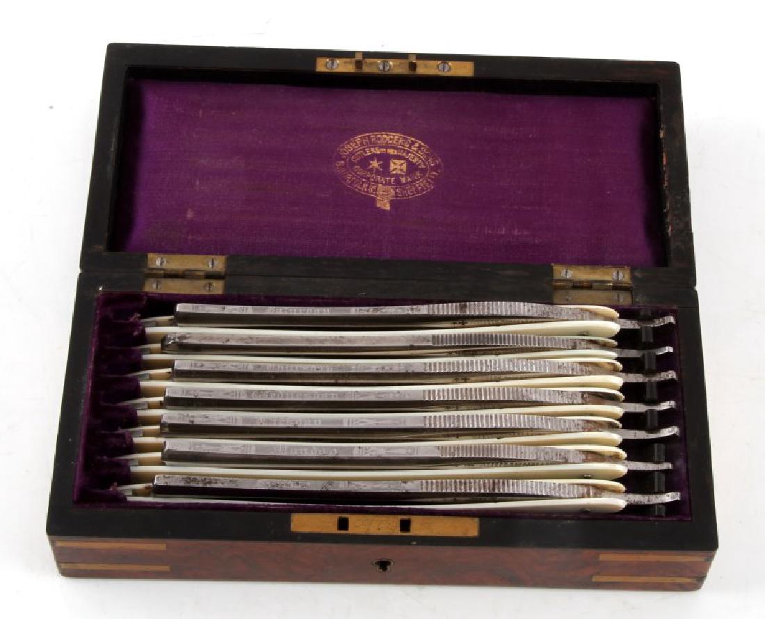 ANTIQUE JOSEPH ROGERS 7 STRAIGHT EDGE RAZOR SET: In fabric lined wooden box with Mother of Pearl strip on cover. Top of each razor is inscribed with a day of the week (the "Friday" one has no date - possible mismatch). Some tarnish present, but all