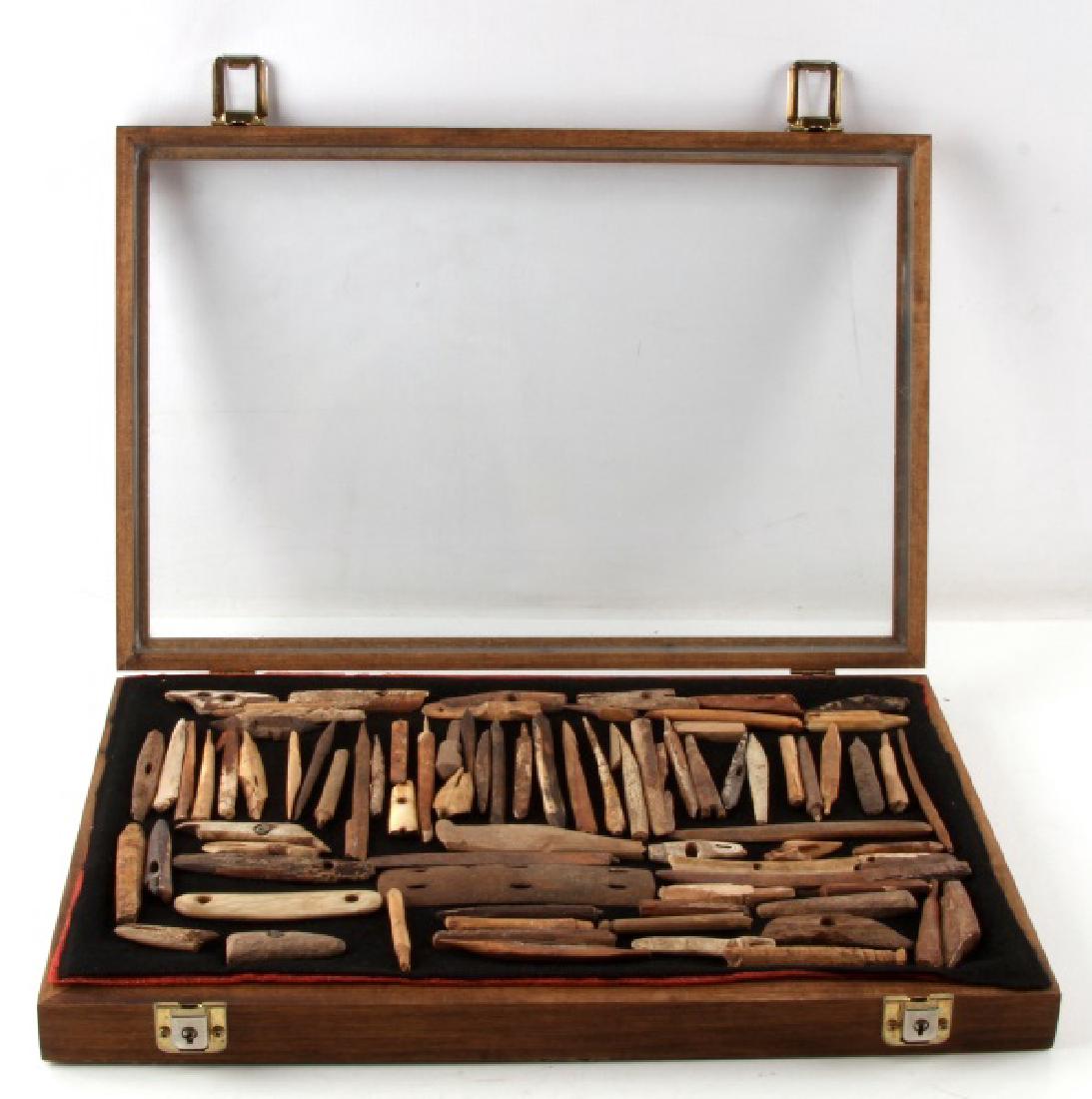 70 + ALASKA FOUND BONE INUIT ESKIMO ARTIFACTS: Some are wood and a wide variety some are complete some are not, in wood and glass frame. Reputedly 1950's surface finds
