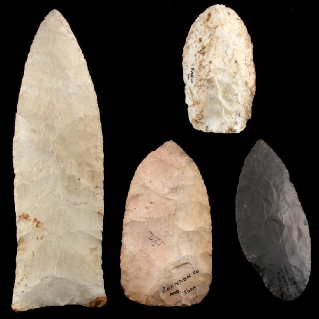 ARCHAIC BLADE SCRAPER ARROWHEAD POINT LOT OF 4: Four large artifacts. One hornstone knife/scraper from Floyd County, Indiana (just under 5 inches), one light pink blade with broad flaking, marked "Shannon Co. Mo. 56M" (5 inches), one hand scraper f