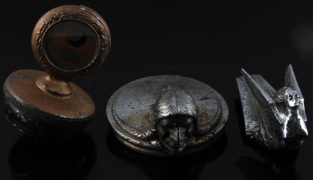 ANTIQUE AUTOMOBILE HOOD & RADIATOR ORNAMENT LOT: Lot of 3 includes Early Plymouth Flying Lady , Pontiac with Indian head, and Ford Radiator Meter cap. They each have loss of chrome/ finish with some pitting.