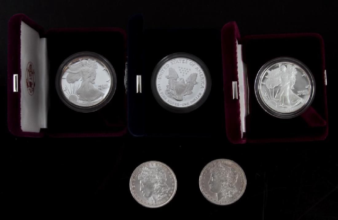 UNC MORGAN & AMERICAN SILVER EAGLE PROOF COIN LOT: Lot consists of 1881 & 1889 Philadelphia Mint uncirculated Morgan Silver Dollars along with a 2001 W American Silver Eagle in box with COA and both 1986 & 1987 San Francisco Mint American Silver Eagle