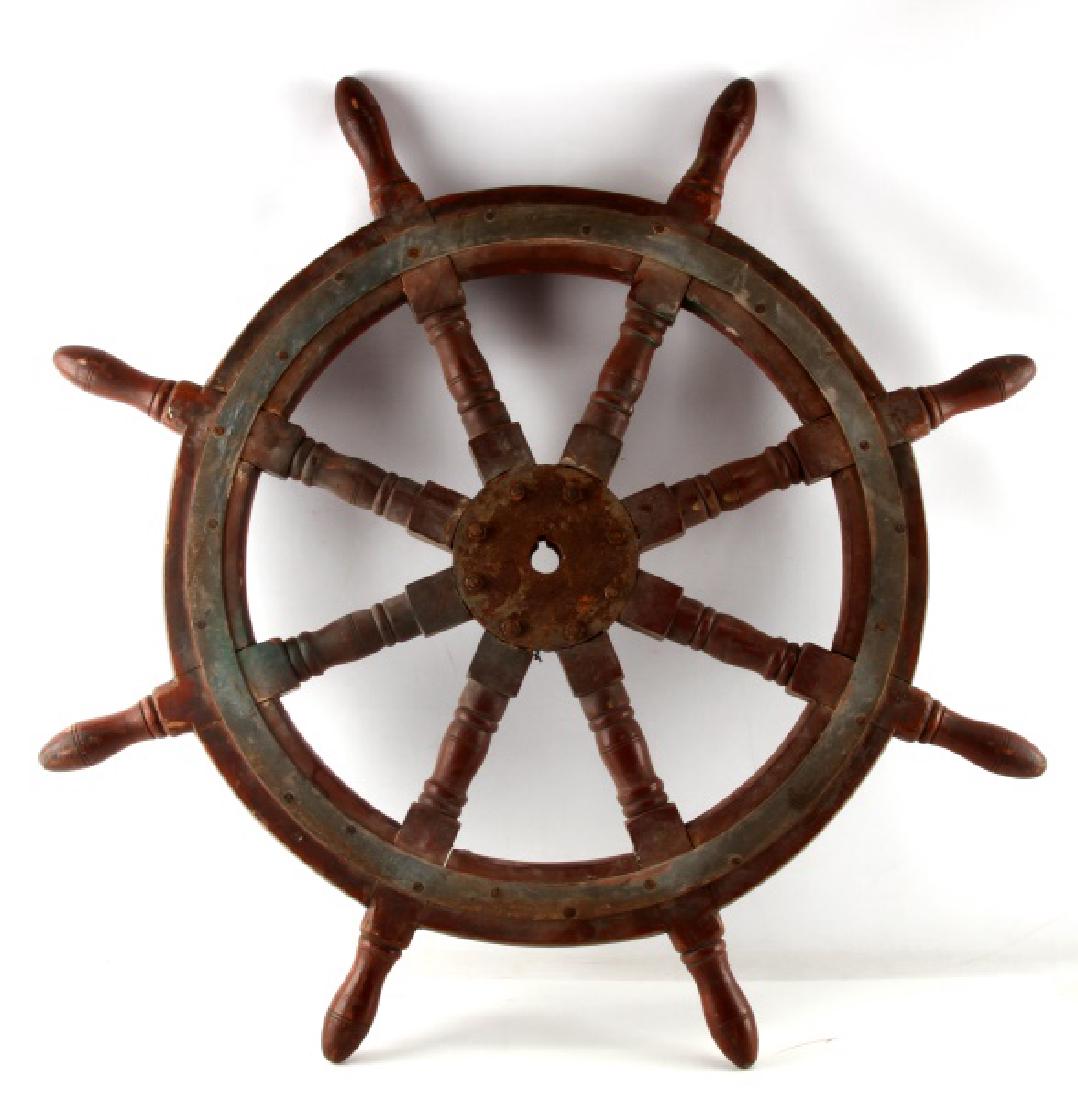 ANTIQUE MARITIME WOOD & METAL SHIP PILOT WHEEL: Antique ships wheel, CA. 1900, with metal mountings, in good condition varnish and paint and aged and worn and metal has rusty patina. Measures 38 inches in diameter, 24 pounds