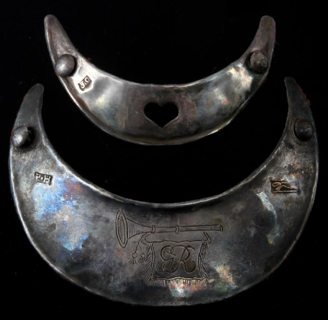 2 NATIVE AMERICAN ANTIQUE SILVER FUR TRADE GORGETS: First Gorget measures 63 millimeters across and has a heart shape punched out of the front center, to the left of the heart is a Hallmarked JS. The second is 90 millimeters across. On the front center