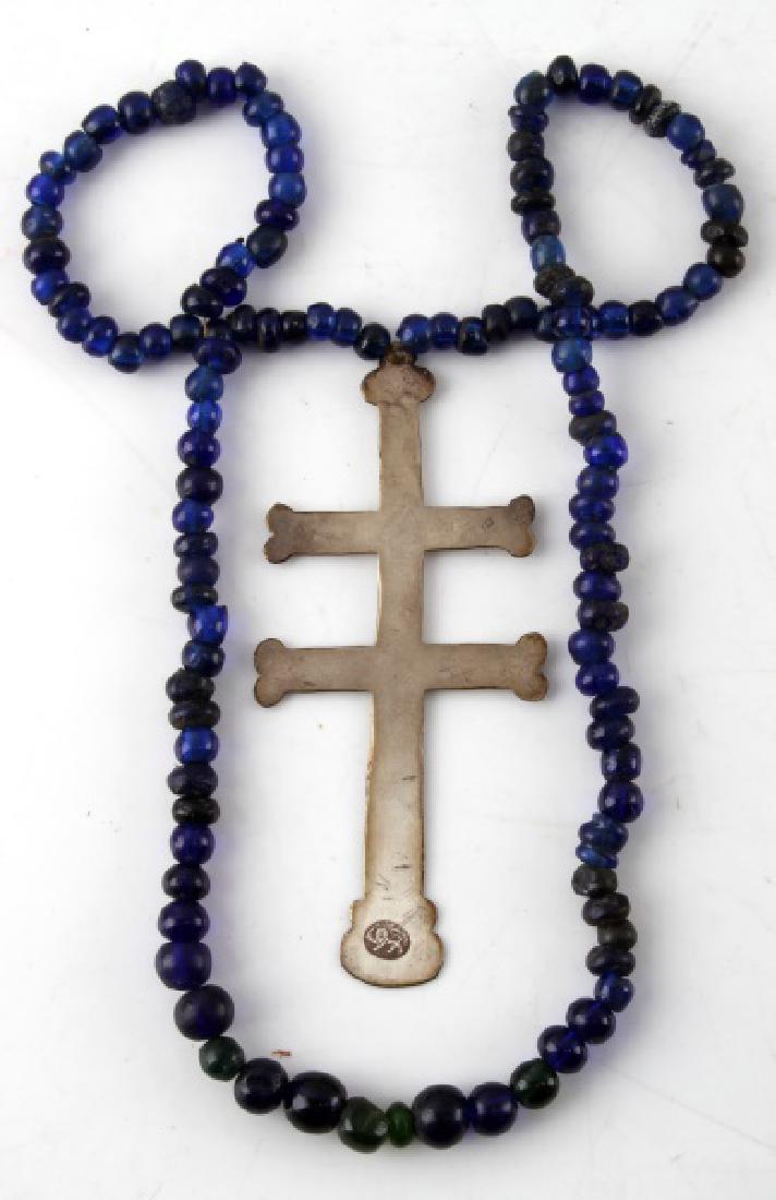 NATIVE AMERICAN ANTIQUE FUR TRADE SILVER CROSS: Silver two-barred Cross of Lorraine from the fur trade with Native Americans. It has a hallmark consisting of a lion passant facing left with a sword in its paw. It is 4 /12 inches in length with a so