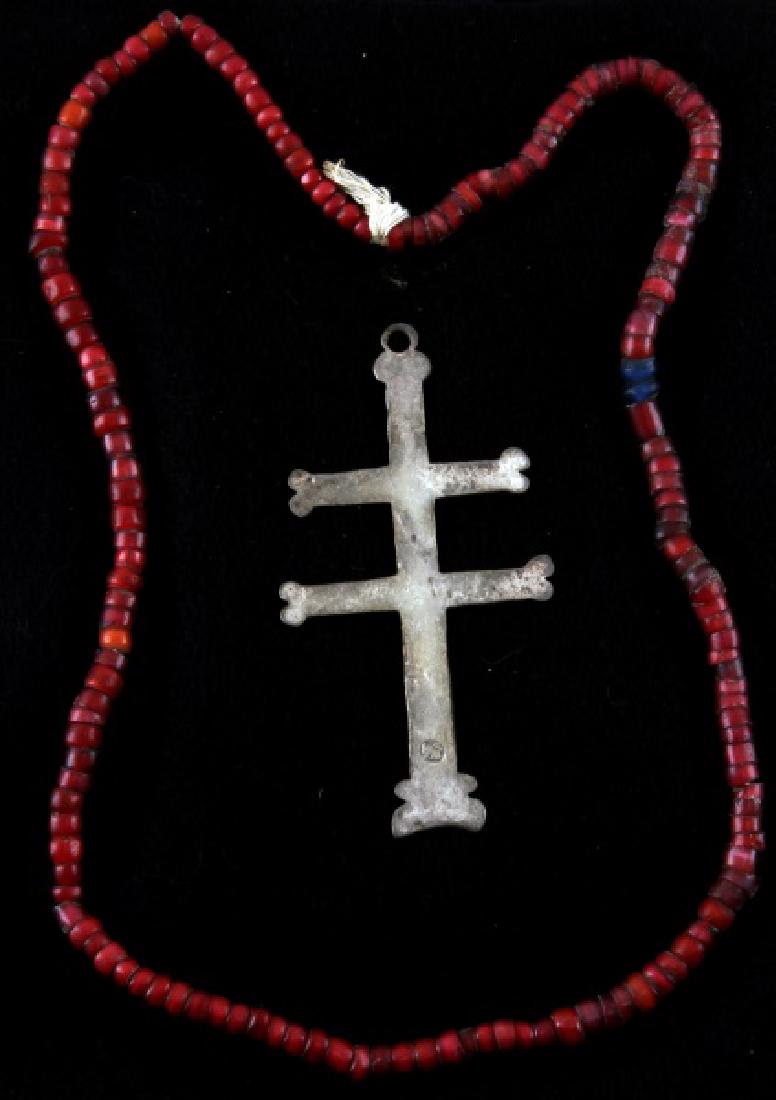 ANTIQUE NATIVE AMERICAN FUR TRADE SILVER CROSS: Silver two-barred Cross of Lorraine from the fur trade with Native Americans. Has a maker's mark consisting of a lion passant facing left with a sword in its paw on the bottom. It is 3 1/2 inches in l