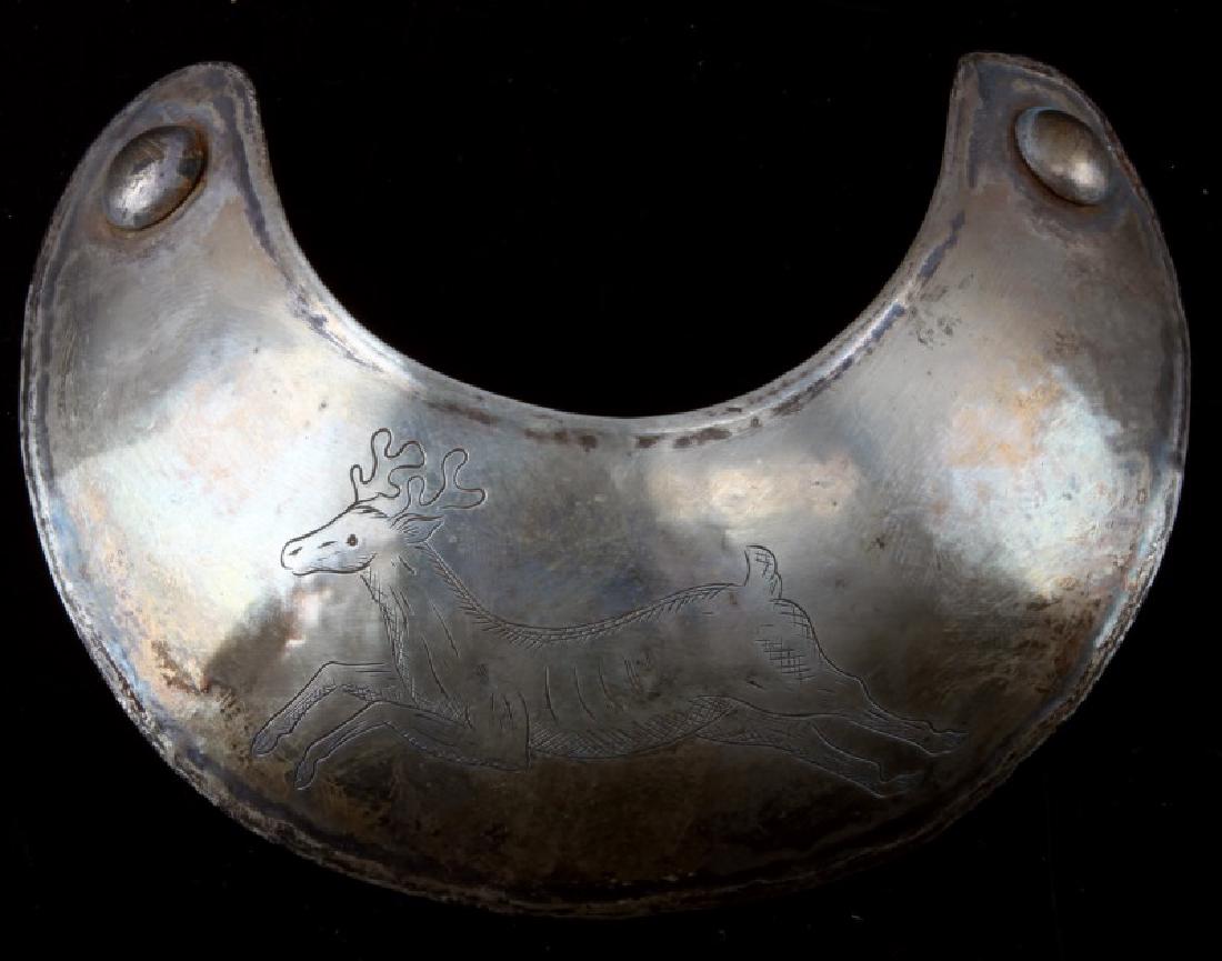 NATIVE AMERICAN ANTIQUE FUR TRADE SILVER GORGET: Measures 5 inches across and is in very good condition. The obverse has a deer running in the center. No visible hallmarks, tested for silver content. Ex. Montague collection. This lot has a reserve.