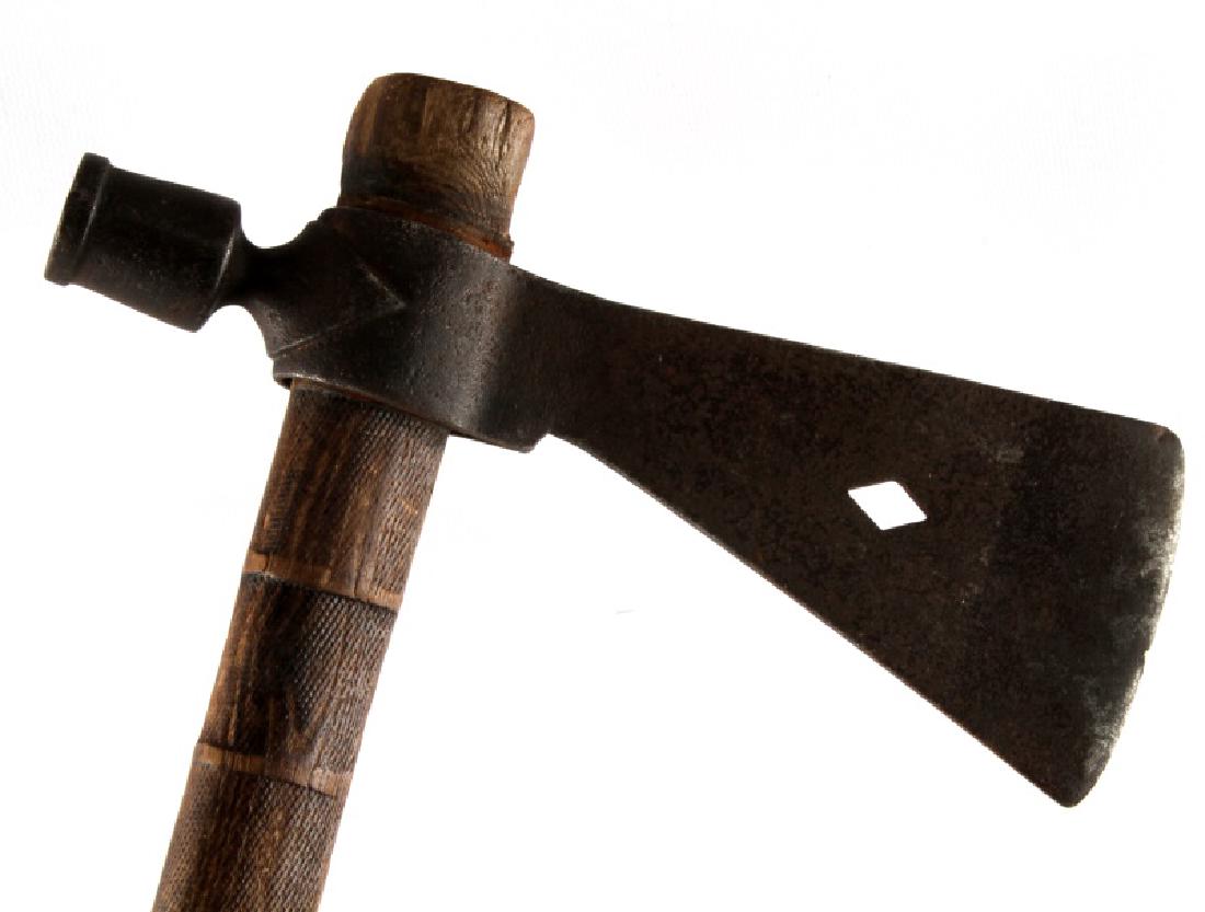 1820 NATIVE AMERICAN FUR TRADE PIPE TOMAHAWK: Fur trade pipe tomahawk attributed to the Souix in 1820, has a diamond-shaped cutout in the center of the axe head. In good condition, metal head has detached from shaft, but still fits snugly on the 