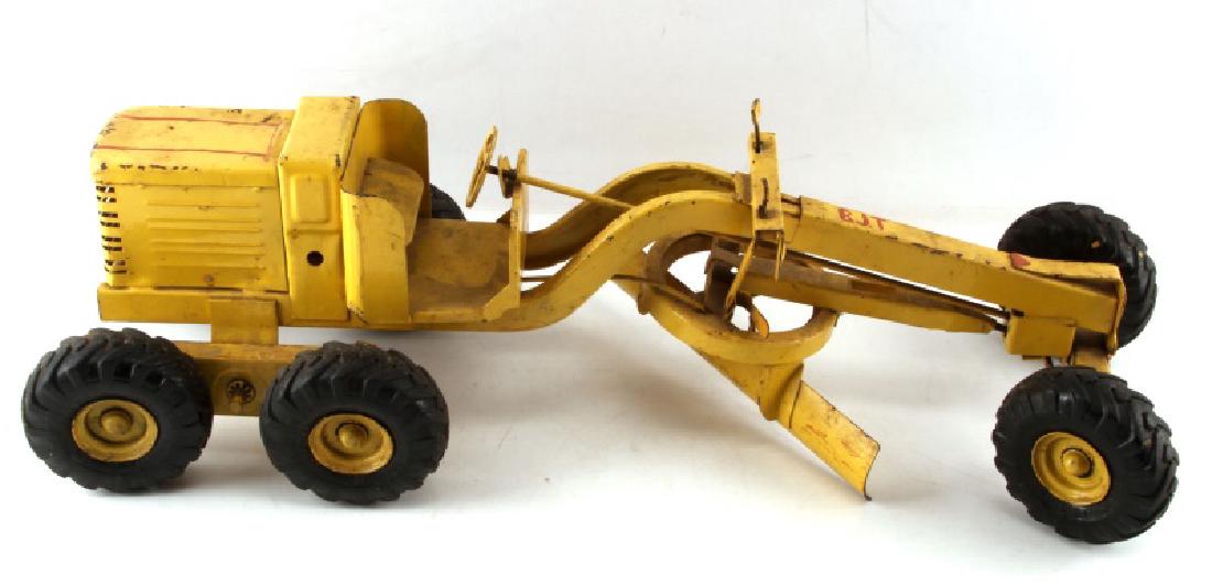 DOEPKE ADAMS ROAD GRADER PRESSED STEEL TOY TRUCK: Yellow Doepke Adams Road Grader (3 pieces: Jaeger, Unit, Adams). Rubber Good Year tires. Acquired in Macungie, PA (August 4, 1984). Shows normal age wear and signs of use. Some rust and paint loss pre