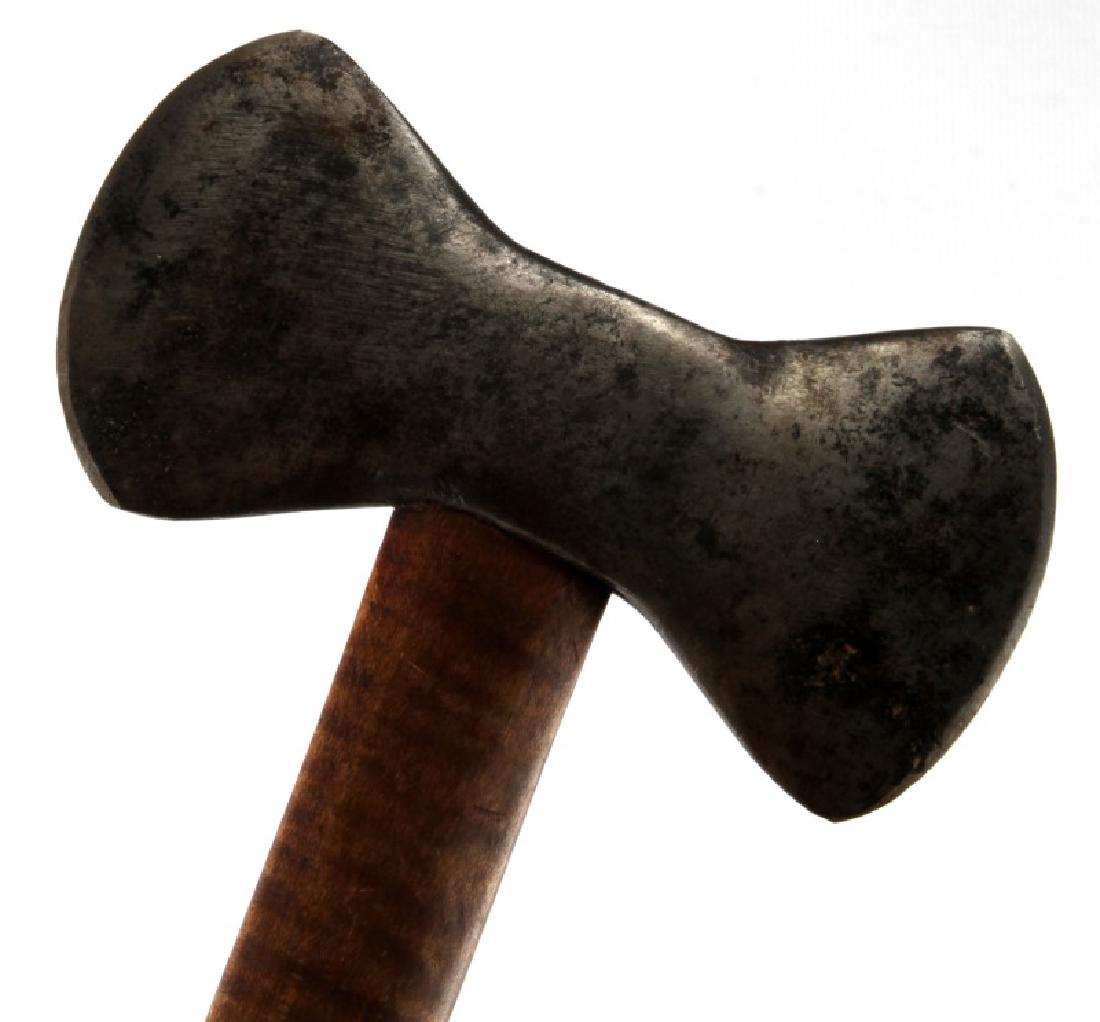 18TH CENTURY AMERICAN INDIAN BUTTERFLY BELT AXE: 18th to 19th century American Indian butterfly belt axe or tomahawk. Measures 16 5/8" in length. Hand forged axe head is 5 3/8". Wood handle sharpened into point. Very good condition.