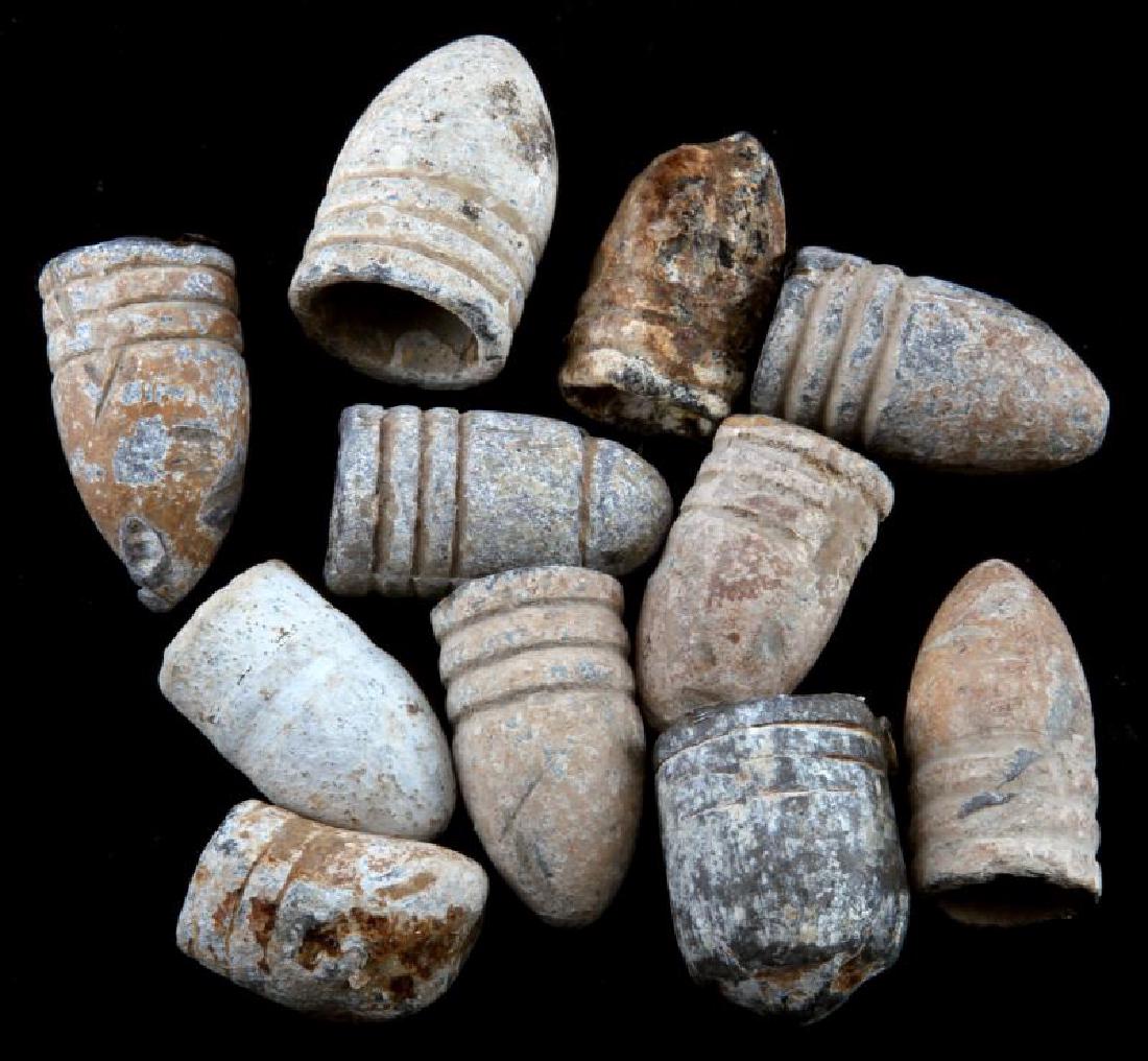 LOT OF 11 AMERICAN CIVIL WAR MINIE BALL ORIGINALS: Lot of 11 Minie balls excavated from various battlefields of the US Civil War. In varying conditions from apparently unfired and undamaged to certainly fired and squashed by impact. Mostly .58 caliber