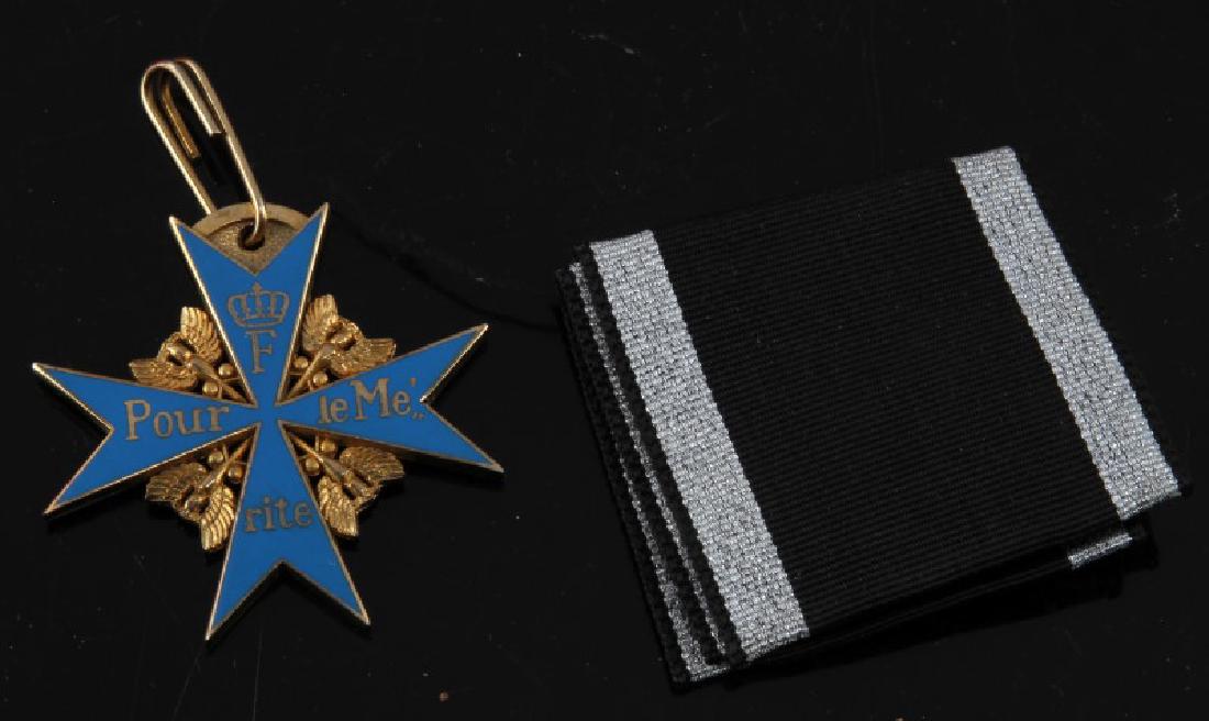 REPRODUCTION PRUSSIAN BLUE MAX GERMAN WWI MEDAL: Museum reproduction of the famed Prussian merit award, the "Pour le Merite", also known as the Blue Max in World War I. Awarded by the King of Prussia to deserving military personnel. Medal comes with