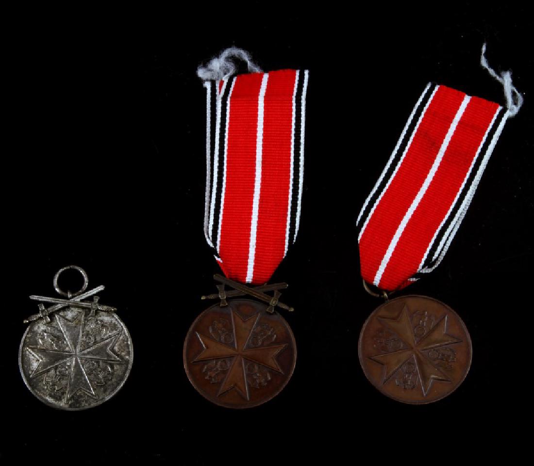 3 GERMAN WWII ORDER OF THE EAGLE MEDALS SLVR BRNZE: 3 German WWII Order of the Eagle medals. Include 1 silver and 2 bronze versions. Both bronze have ribbons. Silver and one bronze feature crossed swords. Bronze are excellent, silver is VG condition.
