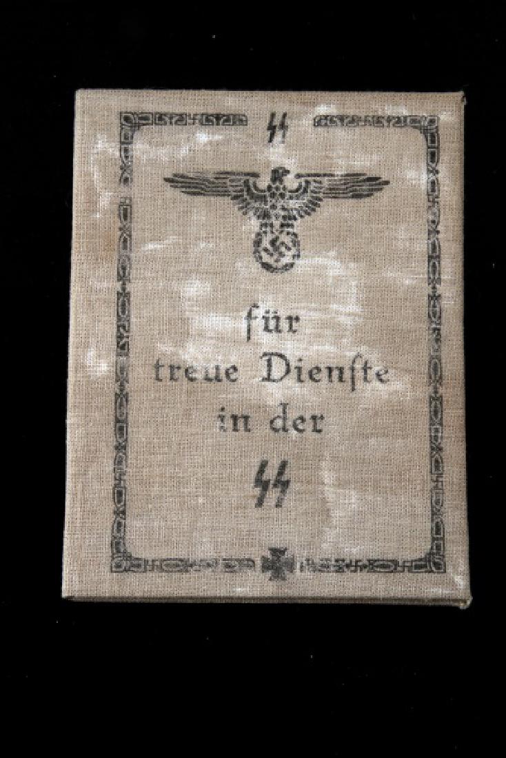 GERMAN WWII THIRD REICH AWARD FOR LONG SERVICE DOC: Has printed signature of Adolf Hitler. Some wear present; overall in very good condition. Unauthenticated, sold as is. This lot has a reserve.