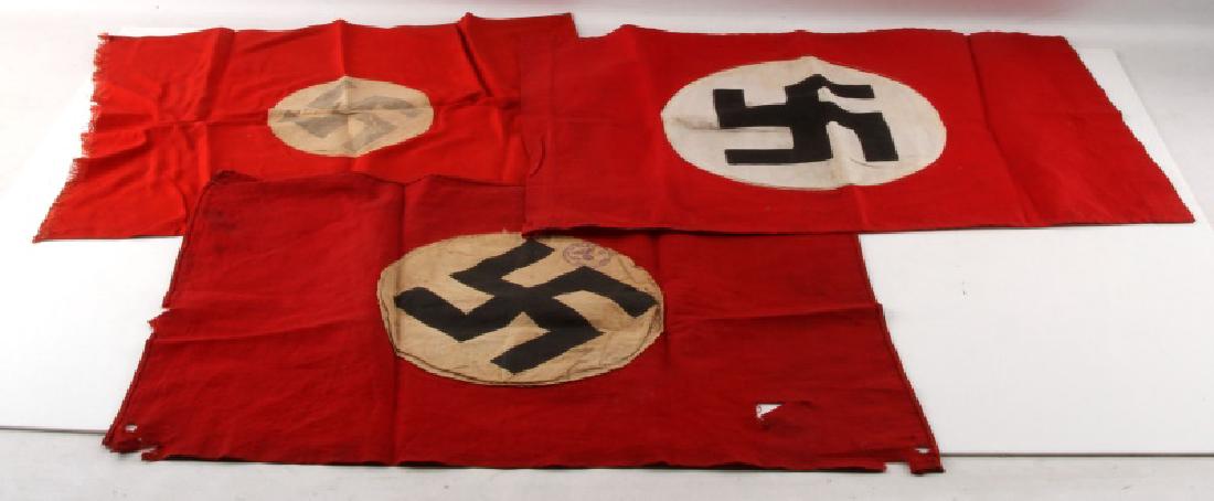 GERMAN WWII 3RD REICH PERIOD SWASTIKA FLAG LOT: 20"x14", 19"x14", 17"x15". Flags range from fair to very good condition. Some fading, a few small rips, and age wear present. Unauthenticated. Sold "as is".
