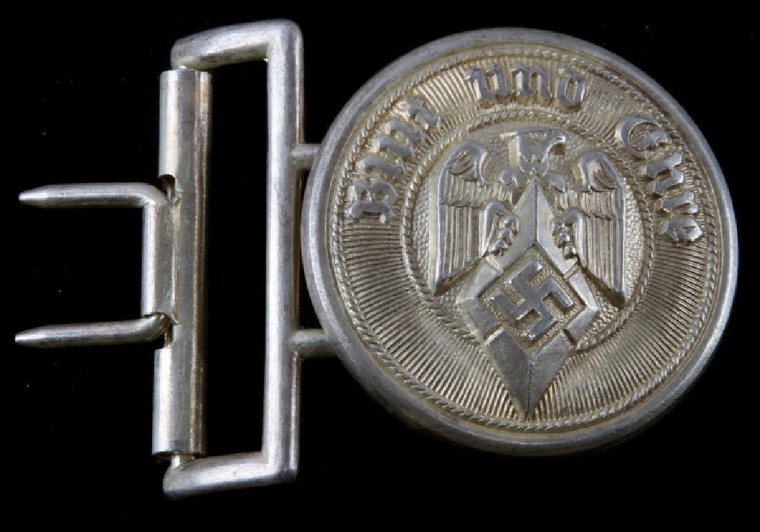 GERMAN WWII HITLER YOUTH HJ LEADER BELT BUCKLE: German WWII Hitler Youth HJ lead officer belt buckle. Measures approx. 2 inches in diameter. Reverse side is maker marked 'RZM/M4/116'. Includes one (1) belt keeper. One-piece stamped nickel construct
