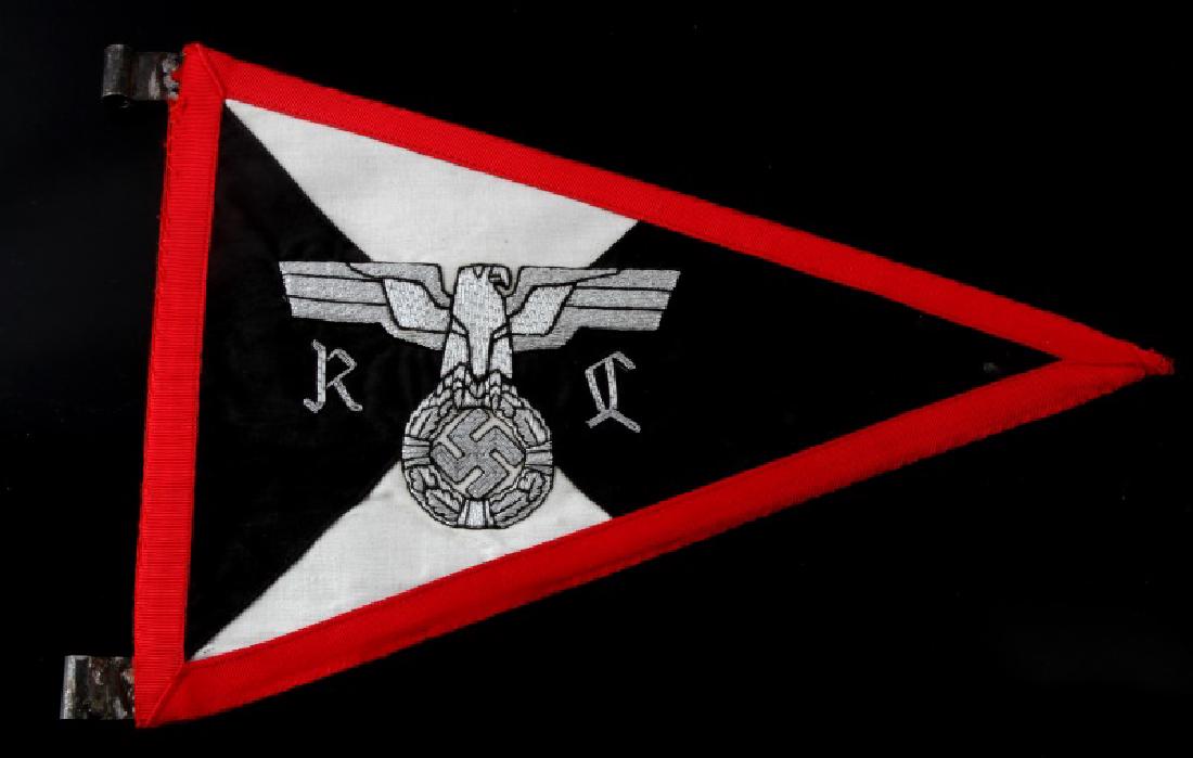 WWII GERMAN NSDAP REICHSLEITER STAFF CAR PENNANT: Measures 12 3/8 inches wide by 8 7/8 inches tall. Shows a silver bullion wire eagle embroidered on four panel cotton backing. Has a triangular metal frame with two metal eyelets for securing to the ve