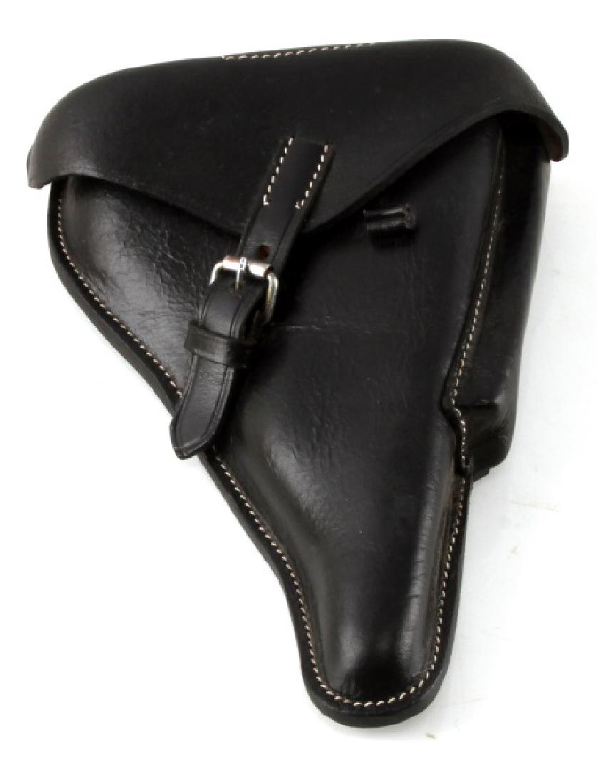 WWII GERMAN PARABELLUM P08 LUGER LEATHER HOLSTER: Measures 7 7/8 inches wide by 10 1/4 inches long. The reverse is marked with a waffen ampt eagle with WaA 655 below. It is machine sewn black leather construction.