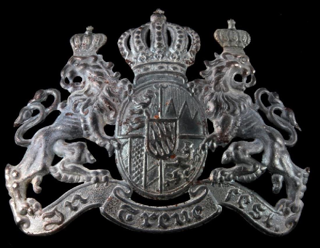 WWI IMPERIAL GERMAN BAVARIAN EM HELMET FRONT PLATE: Measures 4 1/2 inches wide by 3 1/2 inches tall. Stamped steel construction for an enlisted man. There is only one loop on the reverse for securing. Unauthenticated sold as is.