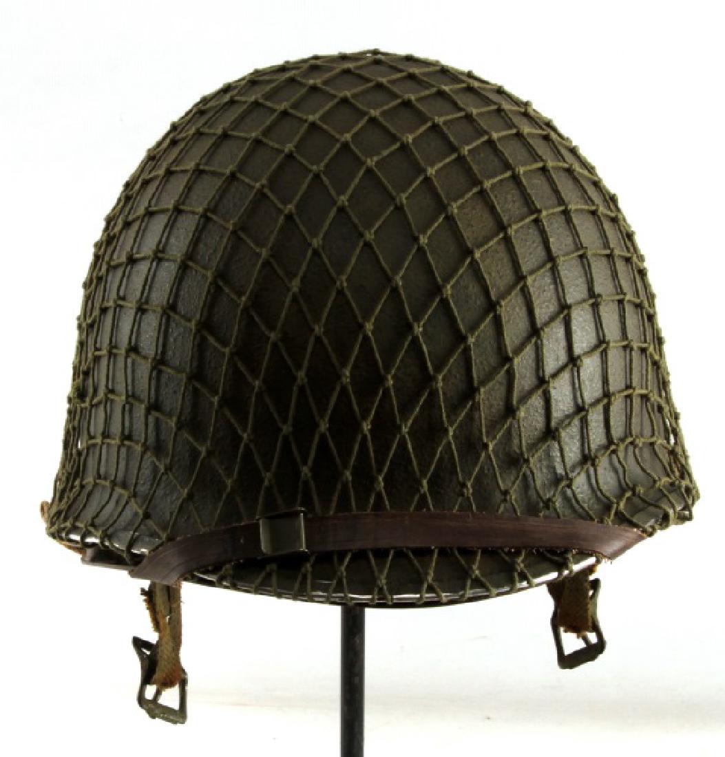 WWII US ARMY AIRBORNE PARATROOPER JUMP HELMET: Has inner liner and chin strap. Has a beige spade hand painted no both sides. Marked W for Westinghouse manufacturing firm. Marked D 33. Has a green camouflage netting.