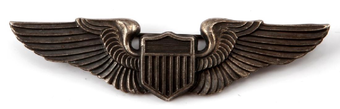 USAAF WWII UNITED STATES ARMY AIR FORCE PILOT WING: Australian made. Measures 3 1/16 inches wide by 13/16 inches tall. Maker marked "Angus & Coote Stg Sil". Has a thin English style pin back.