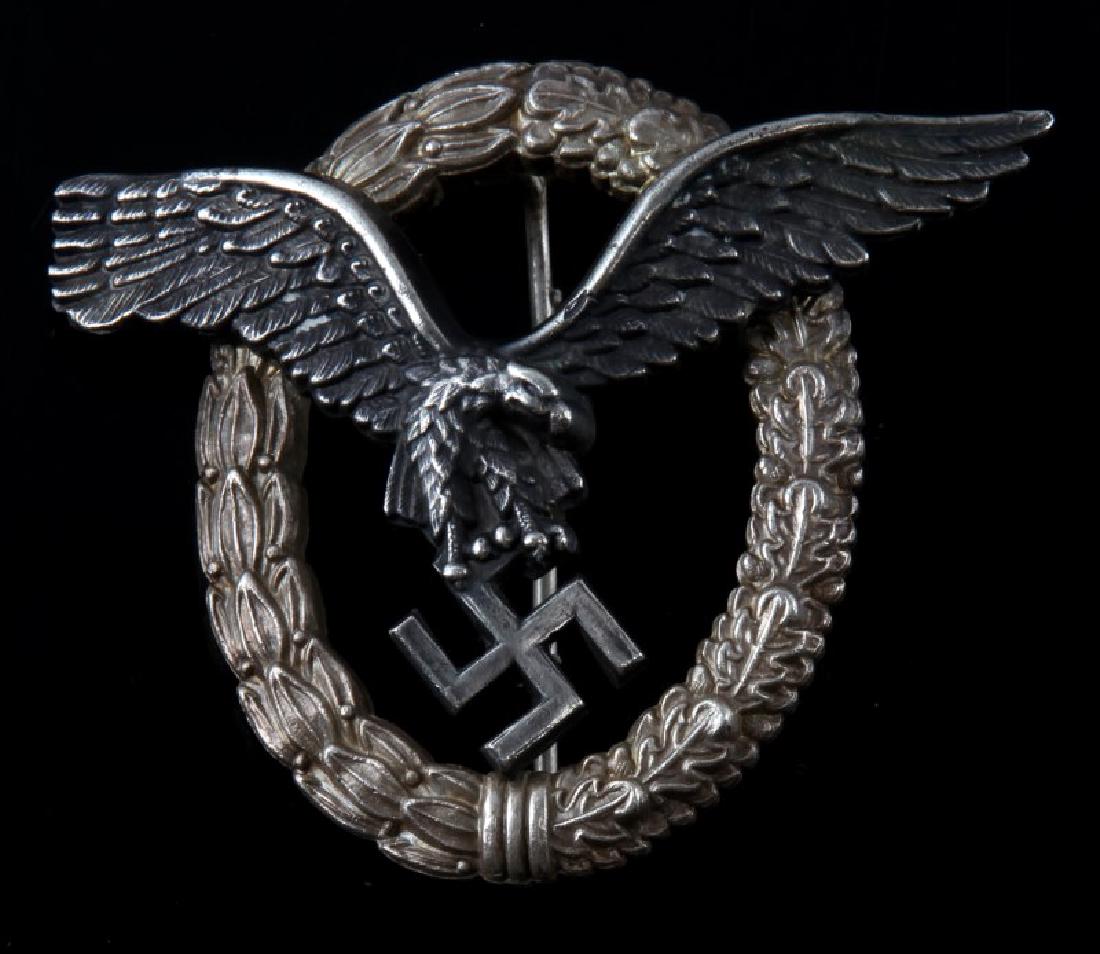 GERMAN WWII LUFTWAFFE PILOT QUALIFICATION BADGE: Maker marked "CE Junker Berlin SW68". Has a thin vertical 'T' bar style pin back. Two piece domed rivet nickel construction. Unauthenticated/Sold 'as is'