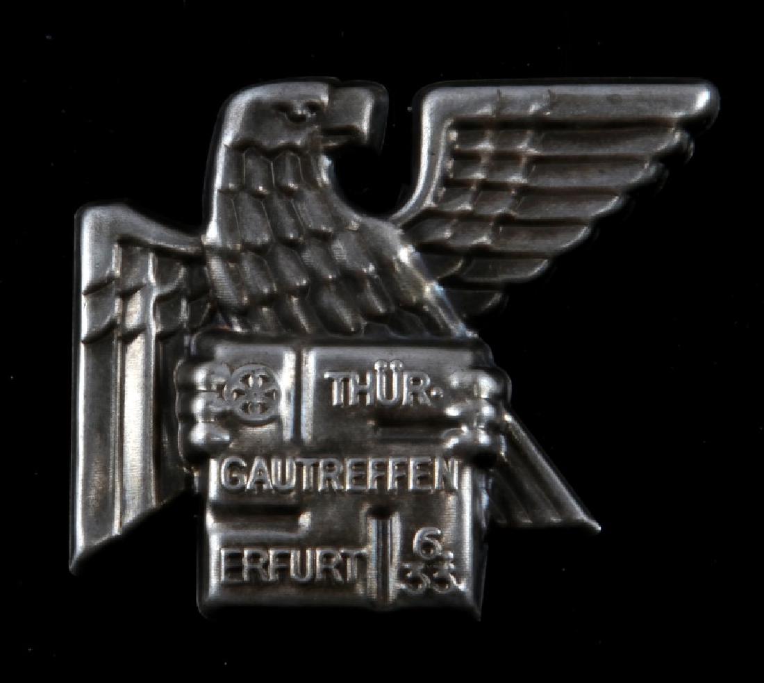WII GERMAN THIRD REICH GAU THURINGEN BADGE: Measures 1 7/8 inches wide by 1 5/8 inches tall. Stamped nickel construction with a thin vertical pinback. No makers mark. Unauthenticated sold as is.