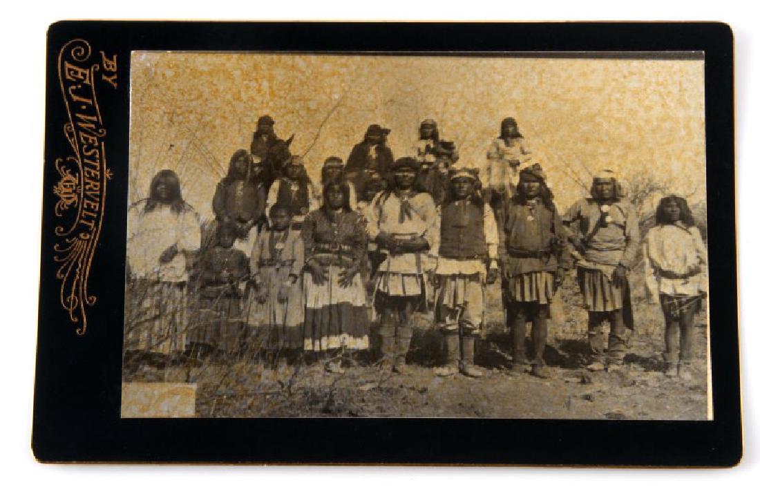 OLD WEST INDIAN WARRIOR CABINET CARD PHOTOGRAPH: Measures 4 3/16 inches wide by 6 7/16 inches tall. The photos logo on the bottom reads by E. J. Westervelt.