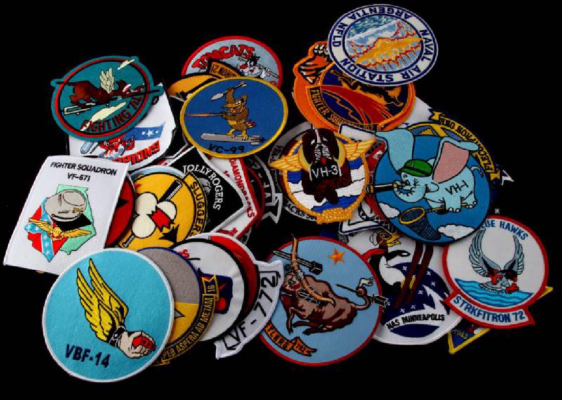 US FLIGHT JACKET CURRENT SQUADRON PATCHES 49 LOT: 49 US Flight Jacket squadron patches. They measure from 4 1/2 inches to 5 1/2 inches wide and long. Machine embroidered on a cotton background.