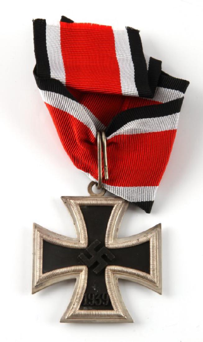 WWII GERMAN THIRD REICH KNIGHT'S IRON CROSS RIBBON: WWII German Third Reich Knight's cross to the Iron Cross, with the suspension ring attached to the Knights Cross itself is maker marked "L/15" for the manufacturing firm "Otto Schinkle Pforzheim". The