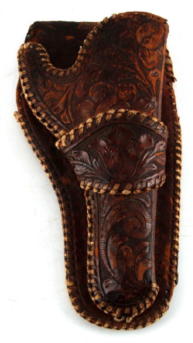 ANTIQUE SINGLE ACTION TOOLED SINGLE LOOP HOLSTER: Holster features the single loop design with hand tooled accents. It is not marked but shows some age with loss of leather binding in sections, please reference photos. The holster is in good conditio