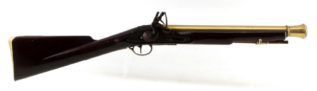 ENGLISH BRANDER BLUNDERBUSS 32 INCHES BRASS: Features 16 flared round barrel, refinished dark wood stock, iron furniture and lock plate with "Brander" mark. Very good condition. Serial #: NSN This lot has a reserve.