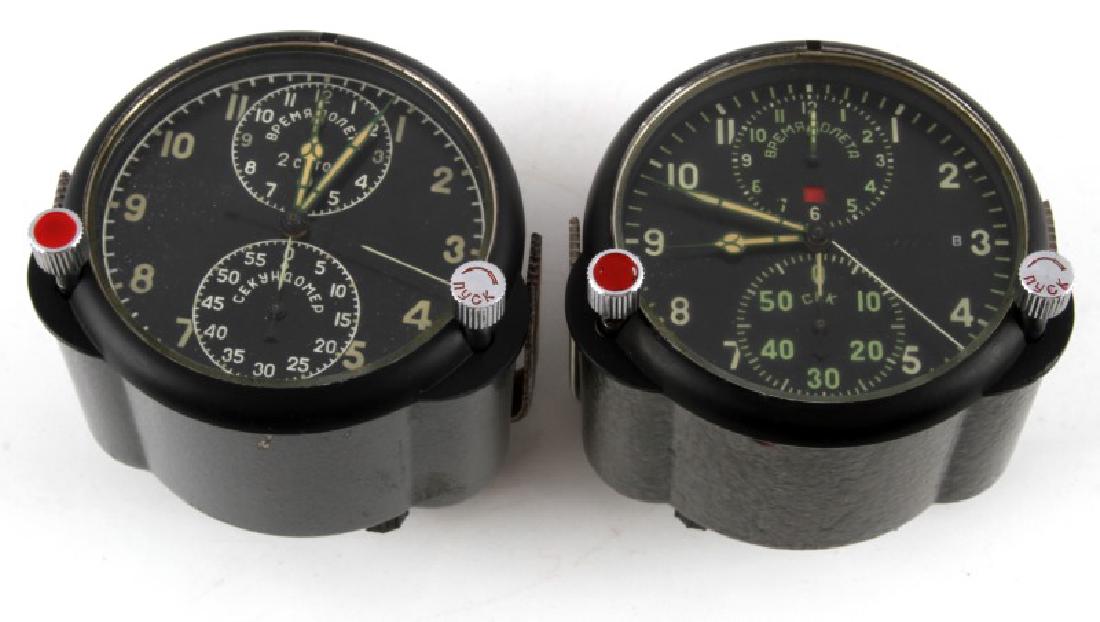 COLD WAR USSR SOVIET ACHS-1 FIGHTER CHRONOGRAPH: 2 Molnija-made ACHS-1 Soviet fighter clocks and chronographs. Both are in very good condition and seem to run properly, but the timing has not been measured. NOL