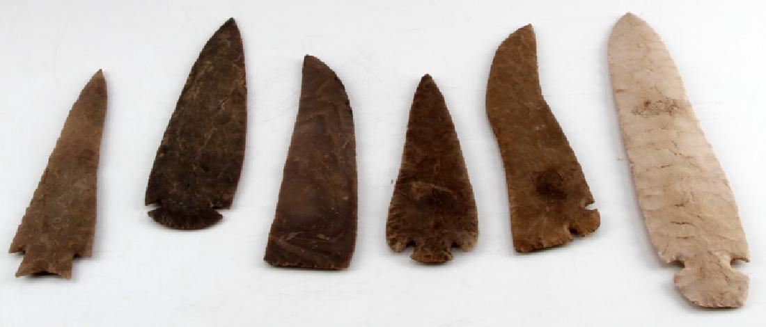 LARGE NATIVE AMERICAN SPEAR HEAD AND SCRAPER LOT: 4 Large spear heads and 2 large scrapers. All are in very good condition. Longest spear head is 14 inches long, while the shortest is 9 1/2 inches long. The two scrapers are 10 and 11 1/2 inches long.