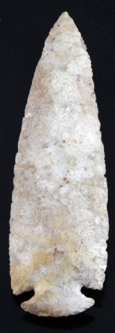 LARGE CHERT STONE ARROWHEAD POINT DOVETAIL BASE: Broad random flaking, good mineral deposits, and well worn patina. Measures 8.5 inches long. Little wear to tip. Very good condition.