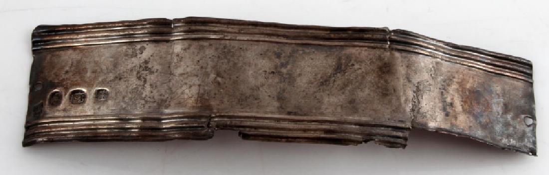 NATIVE AMERICAN ANTIQUE SCRAP FUR TRADE SILVER: Measures 6 inches across. It is a long narrow scrap piece The obverse is hallmarked M then a lions head wearing a crown followed by BS with a crown above. Has been tested for silver content. Ex. Monta