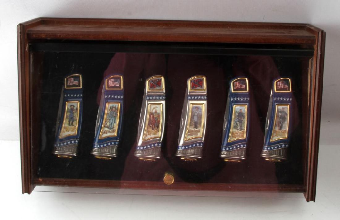 FRANKLIN MINT US CIVIL WAR KNIFE COLLECTION: 6 knives in a wooden display case made by the Franklin Mint as part of a commemorative series. Each knife displays a significant figure from the American Civil War, Union and Confederate. Includes Maj