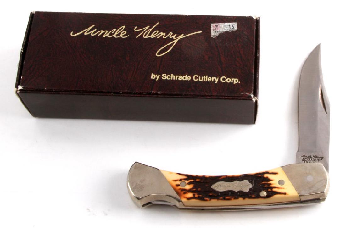 UNCLE HENRY BEAR PAW FOLDING KNIFE BY SCHRADE: Measures 8 1/2 inches total with a 3 1/2 inch blade. Comes with original box and paper work.
