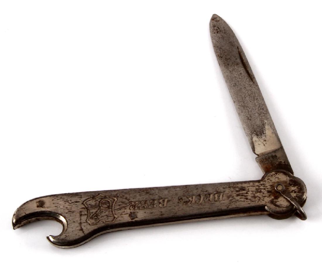 VINTAGE GERMAN BECKS BEER POCKET KNIFE MULTI TOOL: Vintage German Beck's Beer pocket knife. Features a 2 1/2" blade with a bottle opener. Wear from use and age. Good condition.