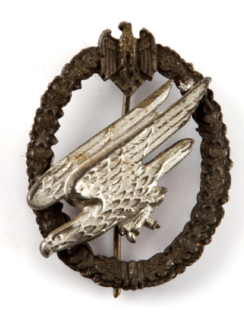 GERMAN WWII LUFTWAFFE PARATROOPER BADGE: German WWII Luftwaffe Paratrooper badge. Unmarked reverse. Thin vertical pin back. Moderate wear. Good condition.