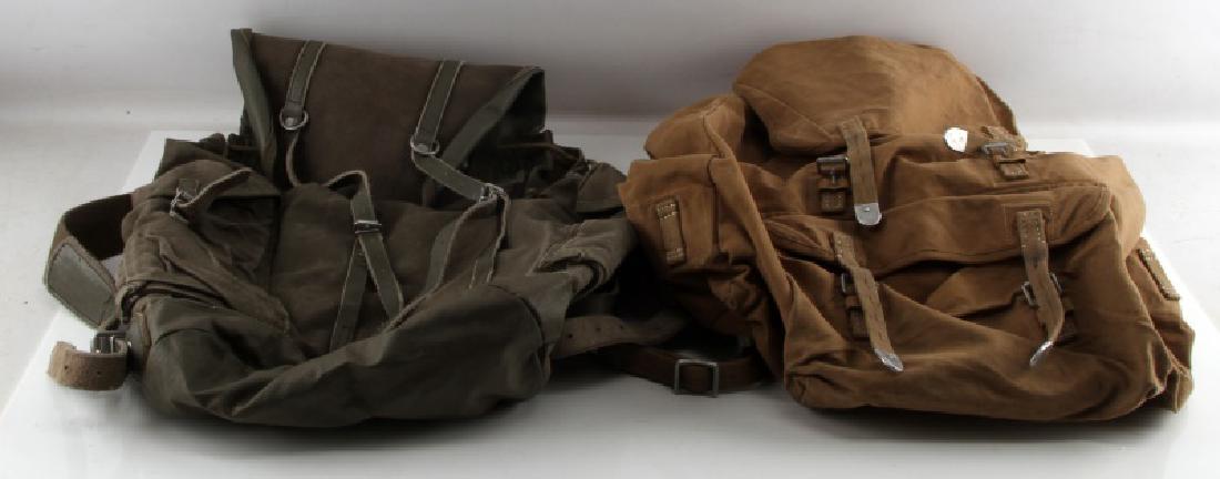 2 CANVAS COTTON MILITARY BAGS BACKPACKS UNMARKED: One tan, one grey green, with buckles and pocket to front. Very good condition.