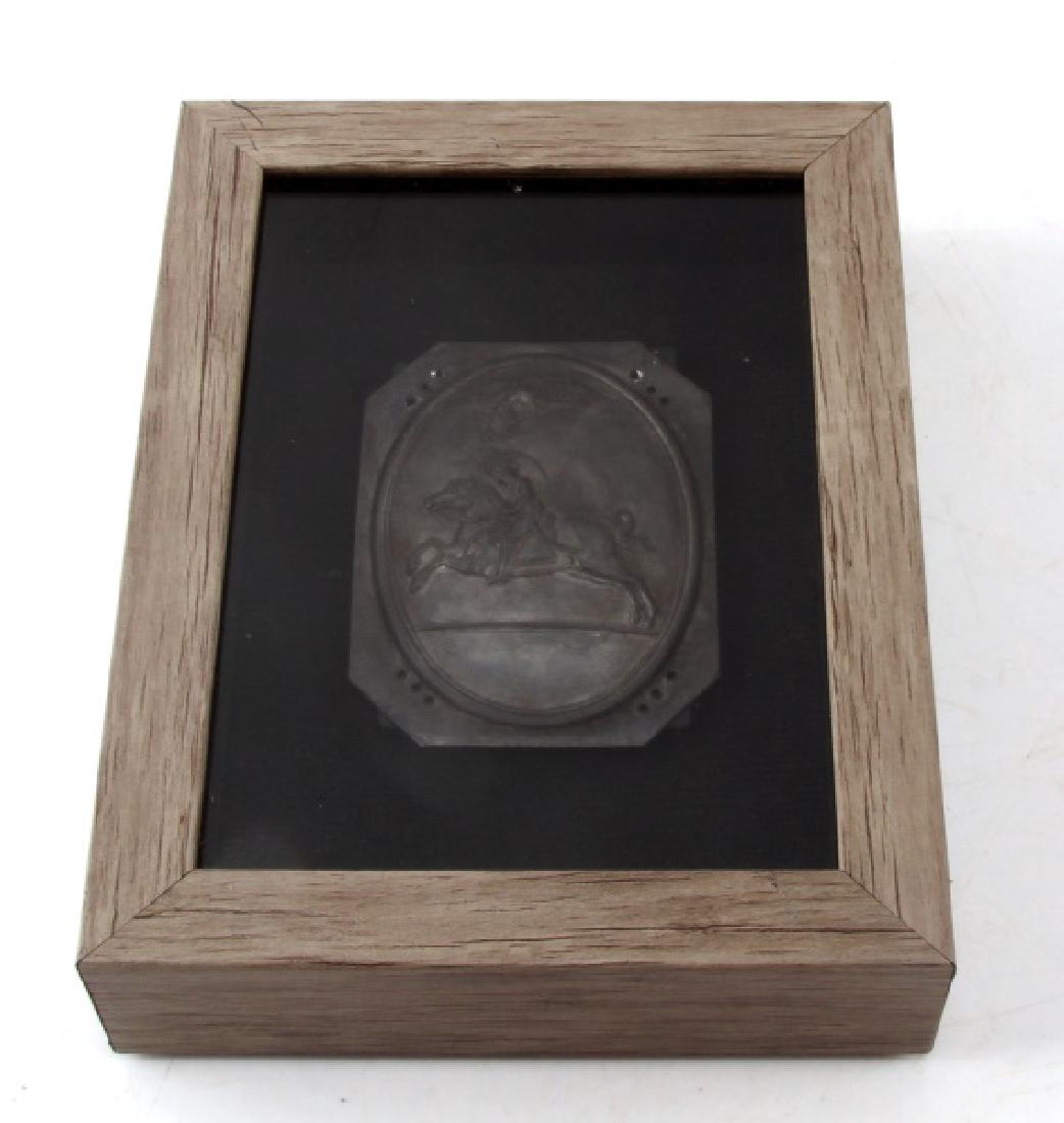 SMALL SILVER PLAQUE CHARGING HORSEMAN AND EAGLE: Small silver plaque of a charging horseman with a raised sword, with an eagle flying overhead with a wreath held in its beak. Mounted in wooden case for display. Plaque has a set of three holes in eac