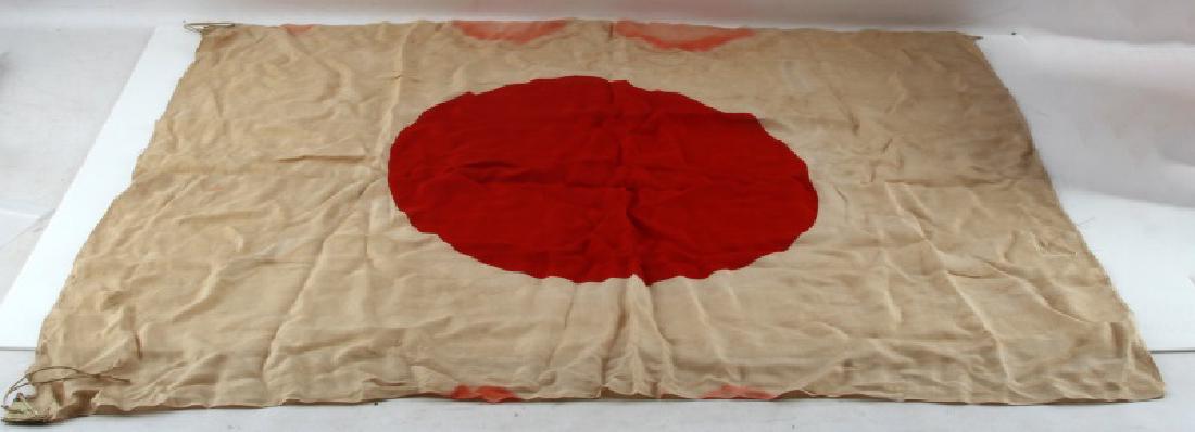 WWII JAPANESE ARMY RED SUN MEATBALL FLAG: Thin double sided flag measures approx. 35"x30". Some heavy stains and red bleeding in spots. A few rips. Age wear present.